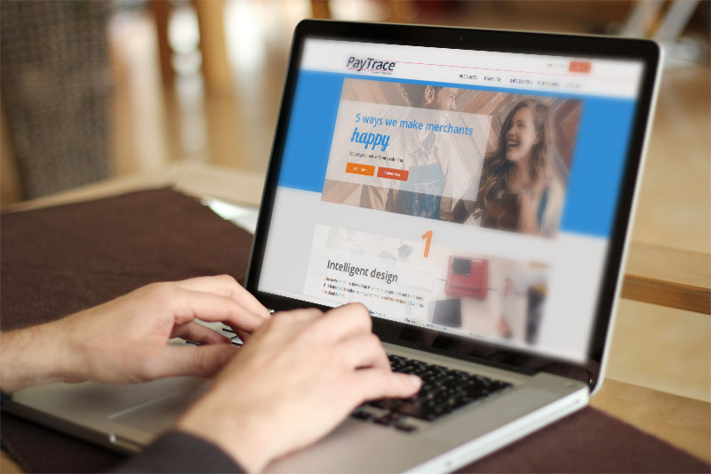 cropped closeup of a person typing on their laptop and browing paytrace