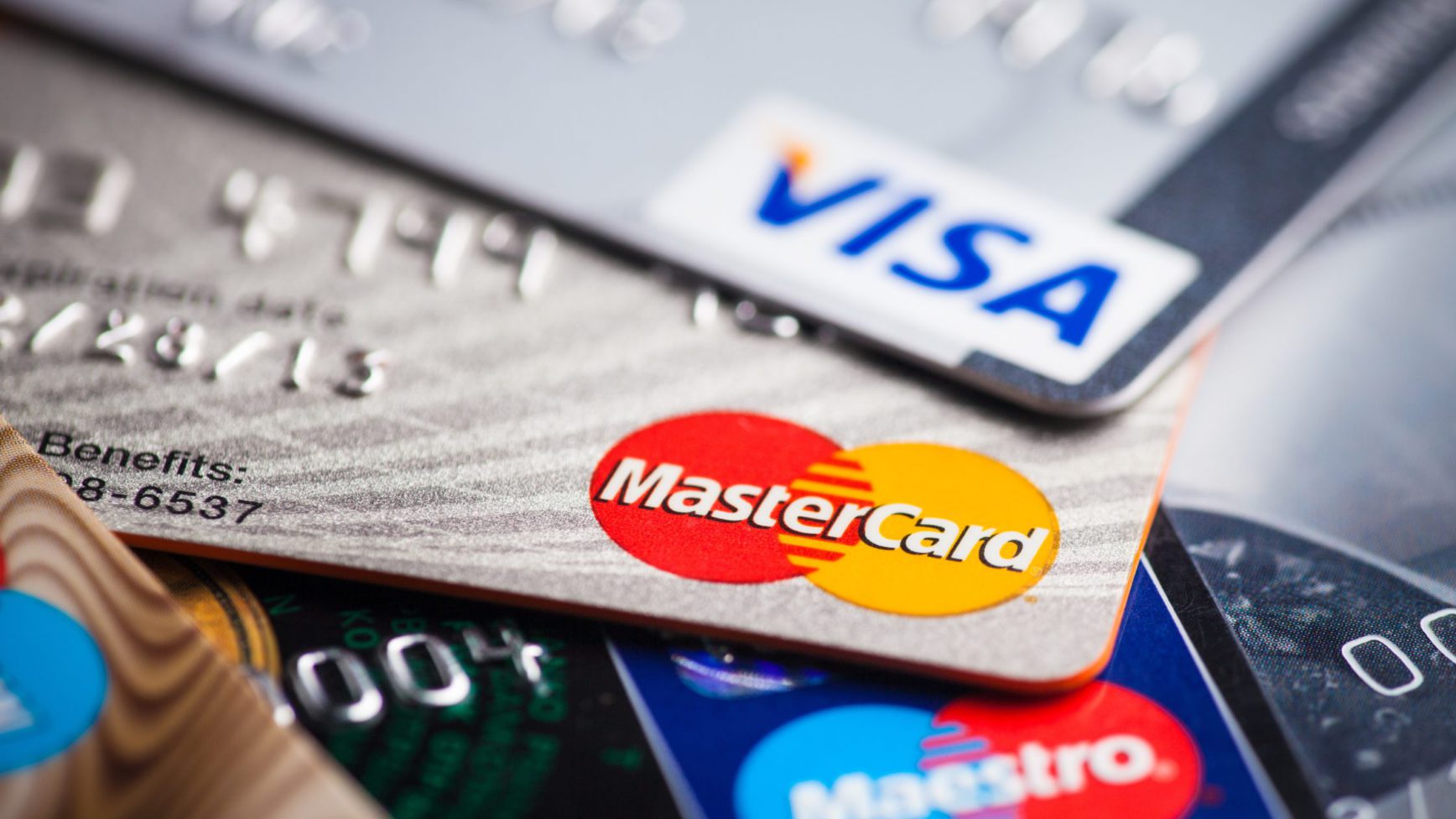 a close up view of a stack of credit cards